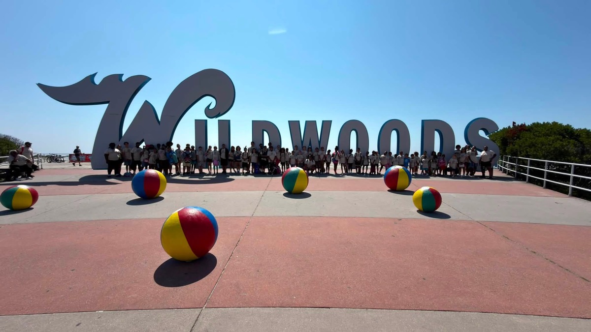 Boys & Girls Clubs of Cumberland County members gathered at the Wildwoods sign on a summer trip to the shore